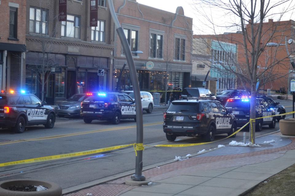 Michigan Avenue is roped off Thursday afternoon as Battle Creek police investigate a fatal shooting near Café Rica.
