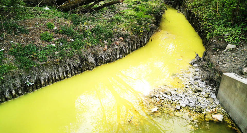 Neon yellow river in Glasgow.