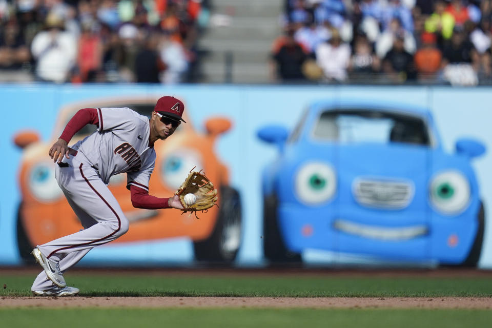 Arizona Diamondbacks third baseman Sergio Alcántara fields a ground out hit by San Francisco Giants' Thairo Estrada during the eighth inning of a baseball game in San Francisco, Saturday, Oct. 1, 2022. (AP Photo/Godofredo A. Vásquez)