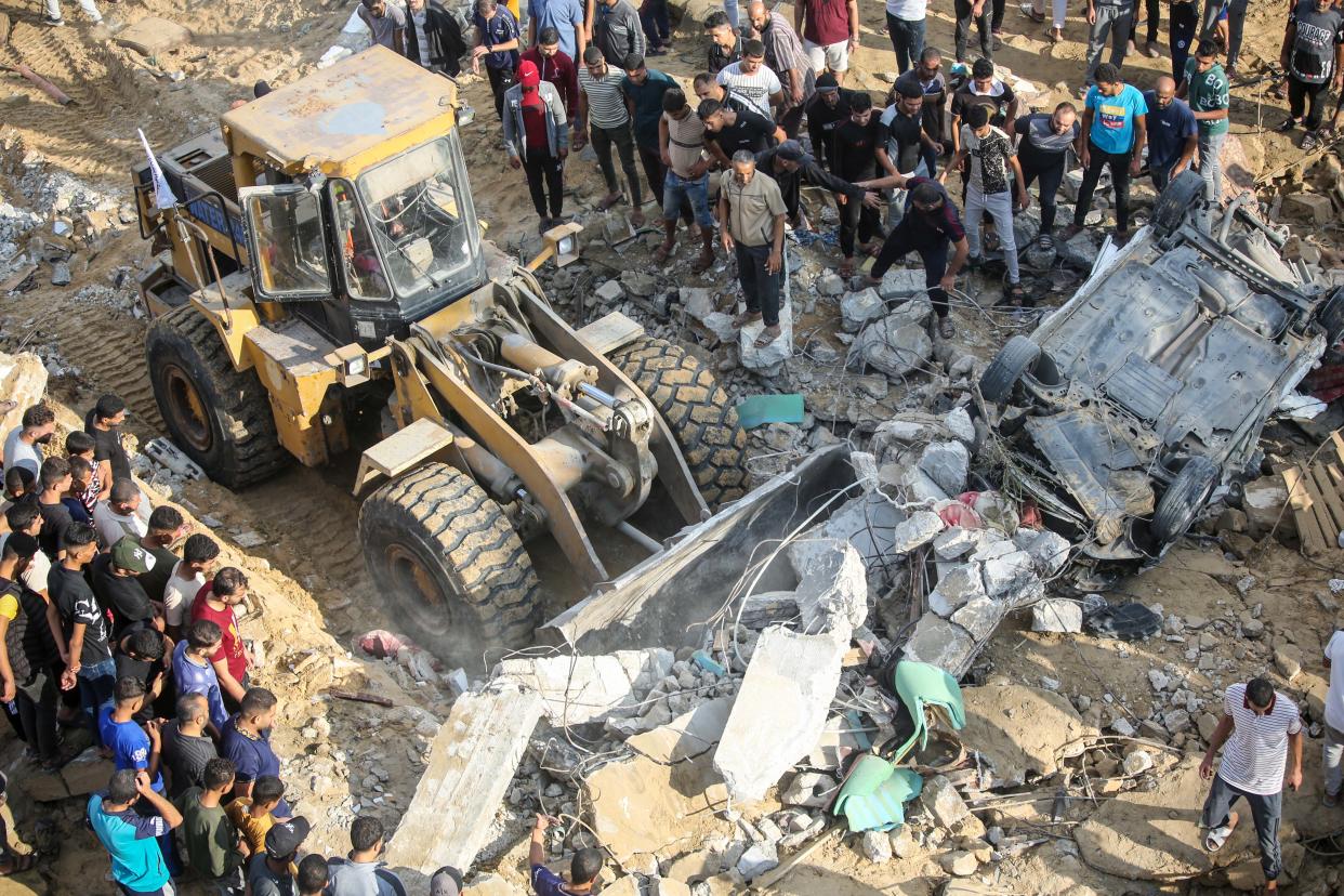 Palestinian citizens inspect their home destroyed during Israeli raids in the southern Gaza Strip (Ahmad Hasaballah/Getty Images)