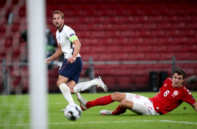 Harry Kane, left, in action against Denmark's Andreas Christensen