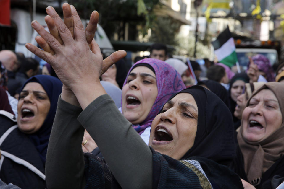 Palestinians women chant slogans during a protest against the White House plan for ending the Israeli-Palestinian conflict, at Burj al-Barajneh refugee camp, south of Beirut, Lebanon, Friday, Jan. 31, 2020. (AP Photo/Bilal Hussein)