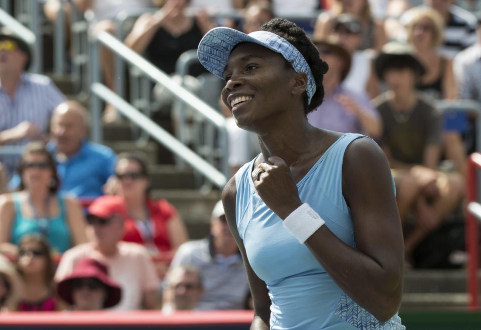 Venus Williams of the United States celebrates after beating her sister Serena 6-7, 6-2, 6-3 at the Rogers Cup Saturday. (AP Photo/The Canadian Press, Paul Chiasson)