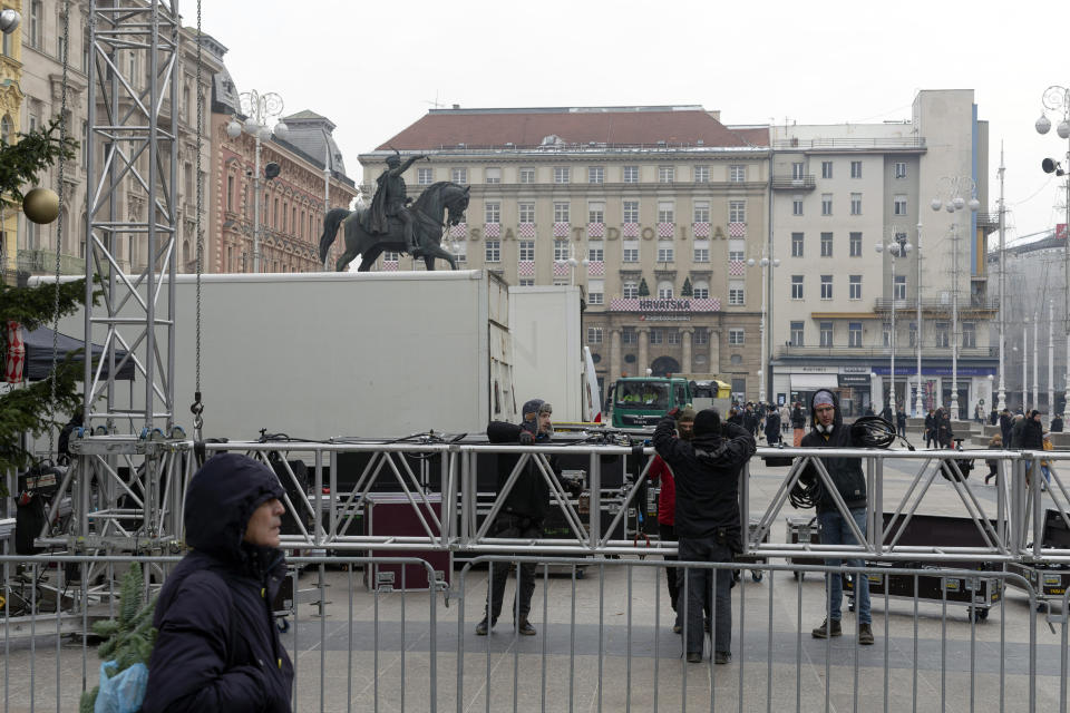 Municipal workers put up a giant LCD screen, prior to the Qatar World Cup soccer semifinal match between Croatia and Argentina in Zagreb, Croatia, Tuesday, Dec. 13, 2022. (AP Photo/Marko Drobnjakovic)