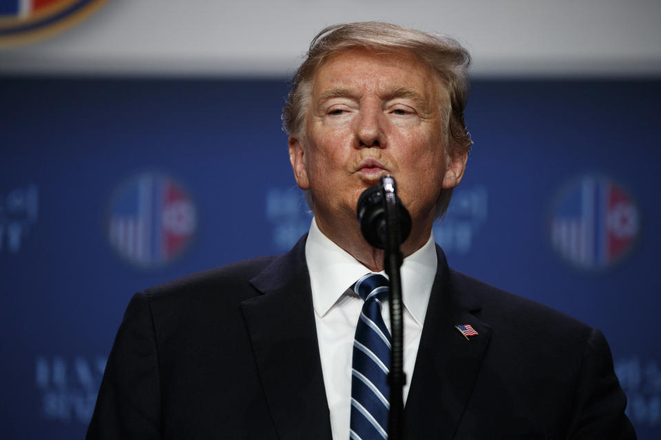 President Trump listens to a question during a news conference after a summit with North Korean leader Kim Jong Un in Hanoi on Thursday. (AP Photo/ Evan Vucci)