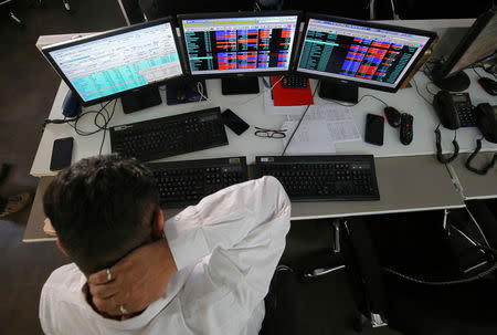 A broker reacts while trading at his computer terminal at a stock brokerage firm in Mumbai, India, December 11, 2018. REUTERS/Francis Mascarenhas