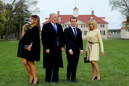 U.S. President Donald Trump and first lady Melania Trump and French President Emmanuel Macron and Brigitte Macron prepare to have their picture taken on a visit to the estate of the first U.S. President George Washington in Mount Vernon, Virginia outside Washington, U.S., April 23, 2018. Reuters photographer Jonathan Ernst: "I'm always happy for events that take us off the White House campus and provide new visual opportunities. This day, when the Trumps feted the Macrons at George Washington's historic estate, it provided just the right contrast for the stylish leader-couples as they took their spots for an otherwise posed moment." REUTERS/Jonathan Ernst