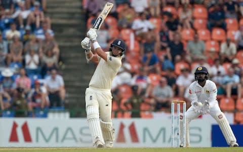 England's Sam Curran (L) plays a shot as Sri Lanka's wicketkeeper Niroshan Dickwella (R) looks - Credit: AFP/Getty Images