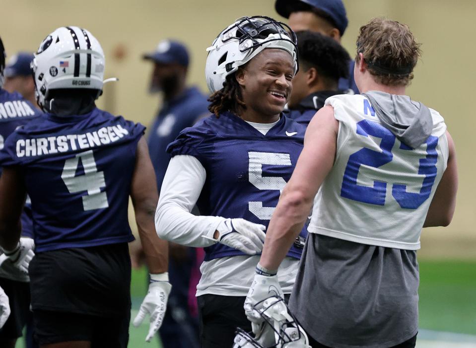 BYU cornerback Eddie Heckard (5) and wide receiver Hobbs Nyberg chat at the end of opening day of BYU spring football camp at the BYU Indoor Practice Facility in Provo, on Monday, March 6, 2023. | Kristin Murphy, Deseret News