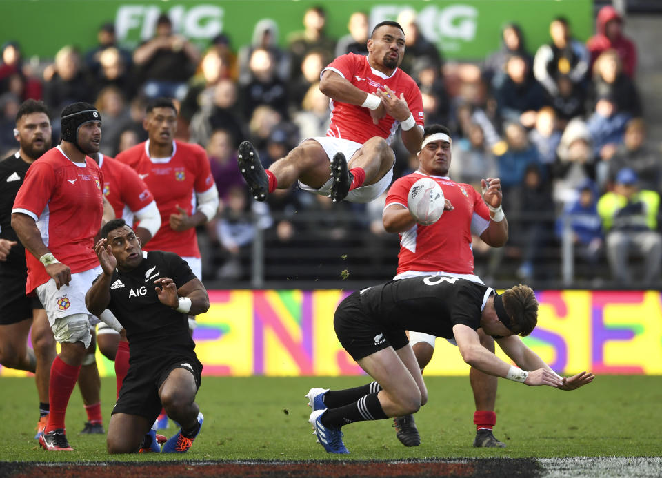 Tonga's James Faiva, top, collides with New Zealand's Jordie Barrett, bottom, during their rugby test match in Hamilton, New Zealand, Saturday, Sept. 7, 2019. The All Blacks defeated Tonga 92-7. (Andrew Cornaga/Photosport via AP)