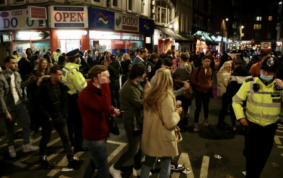 LONDON, UNITED KINGDOM - APRIL 12: People crowd the Soho area after restaurants and pubs, which were closed within the nationwide lockdown imposed to stem the spread of coronavirus (COVID-19), re-open in London, United Kingdom on April 12, 2021. Restaurants and pubs are made available to serve outdoors with the easing of COVID-19 measures. Easing of nationwide lockdown, imposed since January 5th, began. (Photo by Hasan Esen/Anadolu Agency via Getty Images)