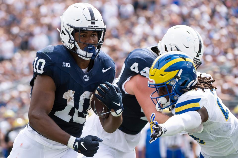 Penn State running back Nick Singleton (10) follows a Tyler Warren block to score a touchdown on a 5-yard run during the second quarter  against Delaware. Singleton is looking for his first big performance since the Rose Bowl victory over Utah.