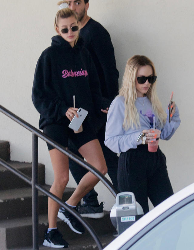 Hailey Bieber flaunts her street style in leggings and crewneck sweater
