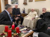 FILE - Pope Emeritus Benedict XVI, third from left, meets with the winners of the 2022 Ratzinger Prize, Joseph Halevi Horowitz Weiler, left, and father Michel Fedou, partially hidden at right, at the Mater Ecclesiae monastery inside the Vatican where Benedict XVI lives, in this photo taken Thursday, Dec. 1, 2022. Pope Benedict XVI's 2013 resignation sparked calls for rules and regulations for future retired popes to avoid the kind of confusion that ensued. Benedict, the German theologian who will be remembered as the first pope in 600 years to resign, has died, the Vatican announced Saturday Dec. 31, 2022. He was 95. Second from left, is the foundation's president Father Federico Lombardi, and fourth from left is Benedict XVI's long-time personal secretary Bishop Georg Gaenswein. (Fondazione Vaticana J.Ratzinger via AP, File)