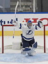 Tampa Bay Lightning goaltender Andrei Vasilevskiy celebrates the team's overtime win over the New York Islanders in Game 6 of the NHL hockey Eastern Conference final, Thursday, Sept. 17, 2020, in Edmonton, Alberta. (Jason Franson/The Canadian Press via AP)