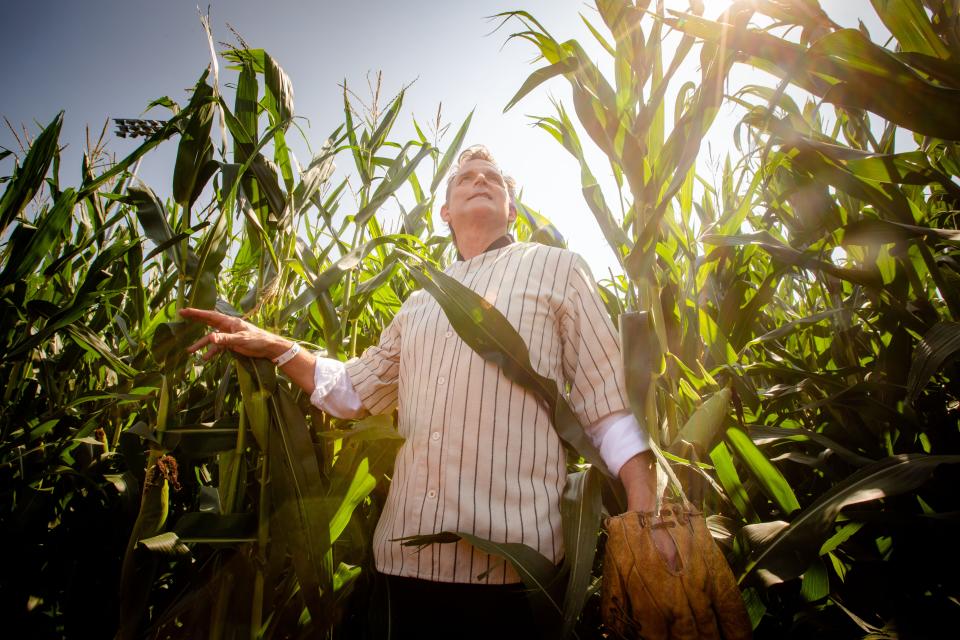 Actor Dwier Brown, who played John Kinsella, the father of Kevin Costner's character in "Field of Dreams," checks out the corn at the Major League Baseball stadium on Aug. 11, 2021 in rural Dyersville.