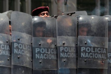 A riot policeman fires rubber bullets during clashes with university students protesting over a controversial reform to the pension plans of the Nicaraguan Social Security Institute (INSS) in Managua, Nicaragua April 20, 2018. REUTERS/Oswaldo Rivas