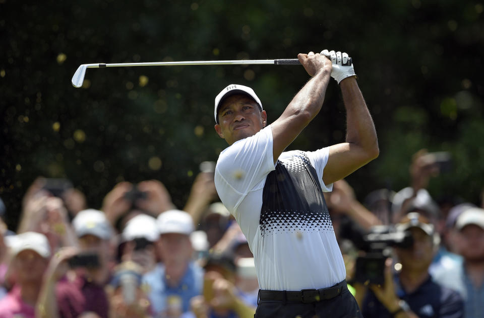 Tiger Woods struggles to keep successful round together Saturday at the Quicken Loans National tournament. (AP Photo)