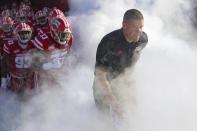 Louisiana-Lafayette head coach Billy Napier, right, enters the field with his team for the Sun Belt Conference championship NCAA college football game against Appalachian State in Lafayette, La., Saturday, Dec. 4, 2021. (AP Photo/Matthew Hinton)