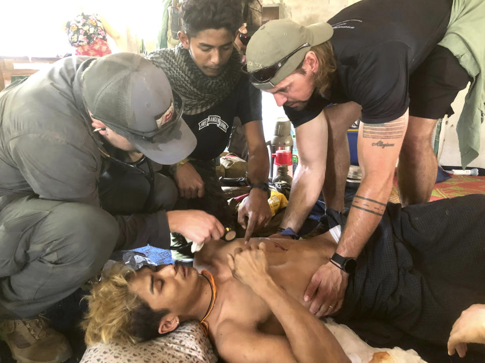 In this undated photo released by the Free Burma Rangers, a wounded person is treated after a Buddhist monastery sheltering civilians displaced by fighting in the town of Papun, Karen state, Myanmar was attacked on March 31, 2024 by a regime warplane. (Free Burma Rangers via AP)