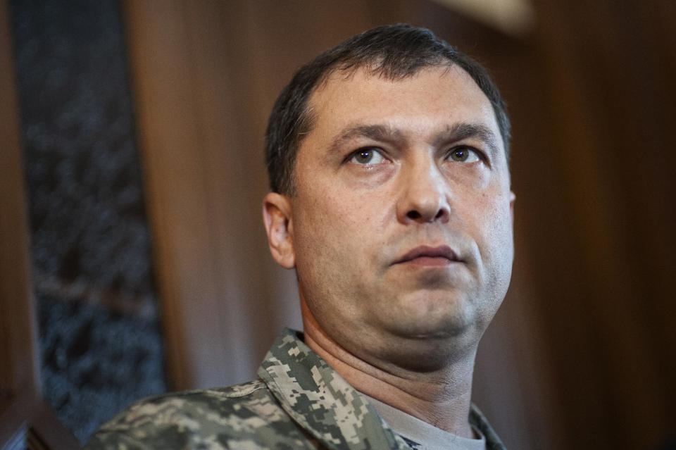 In this photo taken on Saturday, May 10, 2014, Valeriy Bolotov, people’s governor of Luhansk, pauses during a news conference the Ukrainian regional office of the Security Service in the eastern Ukraine city of Luhansk. On Tuesday, Russian news wires quoted insurgents as saying that unidentified assailants fired at a car in which Valery Bolotov, the leader of insurgency in the Luhansk region, was riding. Bolotov was hospitalized with wounds. Bolotov was the one to announce independence Monday for his region. (AP Photo/Evgeniy Maloletka)