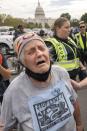 Climate and indigenous activists protest with an act of civil disobedience, Friday, Oct. 15, 2021, by the U.S. Capitol in Washington. (AP Photo/Jacquelyn Martin)