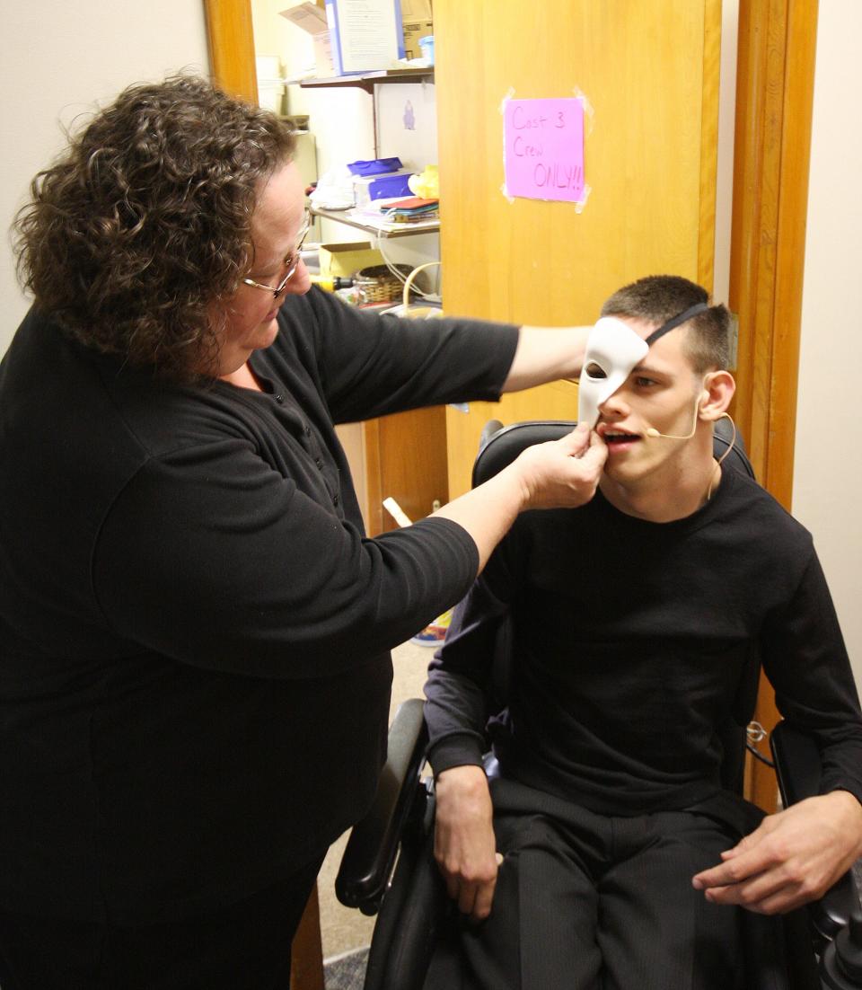 In this 2015 photo, Dodi McGlynn prepares Noah McGlynn for one of his roles during "A Few of My Favorite Broadway Things" show at Emmett Street Missionary Church.