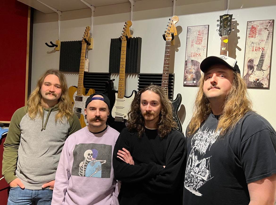 Stark County rock band Beach City Postal Service is shown in their rehearsal space in Sugar Creek Township. The band will be performing on March 16 at a Neil Young tribute concert at The Auricle in downtown Canton. From left are Jake Buckridge, T.J. Gang, Dustin Mayle and Russell Jones.