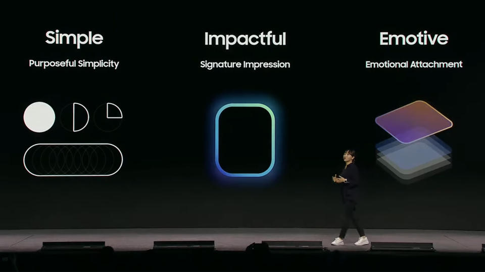 Samsung on stage in front of the screen showing the three design principles: simple, effective and emotional.