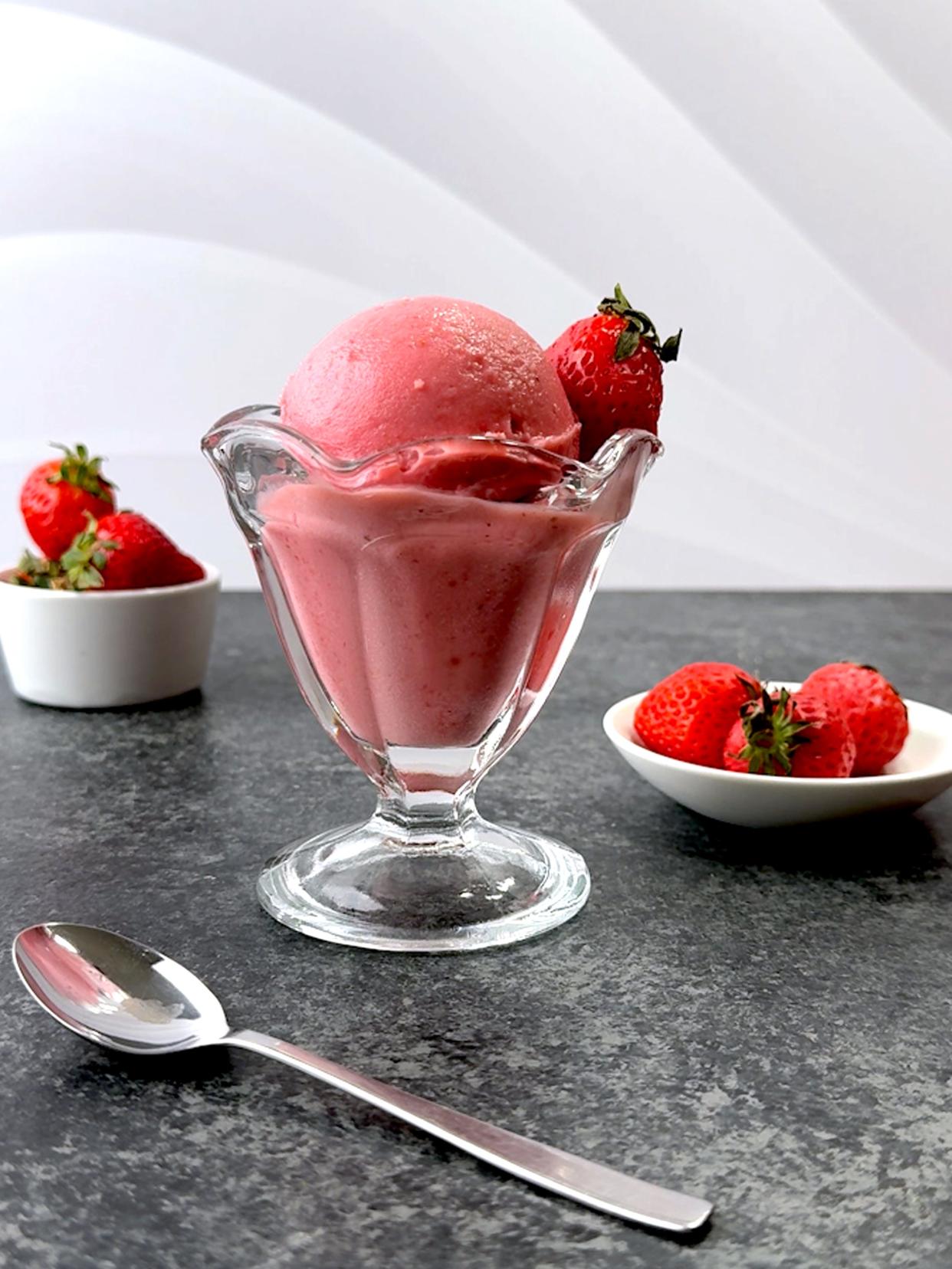 Fresh strawberries are added to Greek yogurt, rich in calcium, vitamin B12, and other essential nutrients, making frozen fresh strawberry yogurt a guilt-free indulgence.