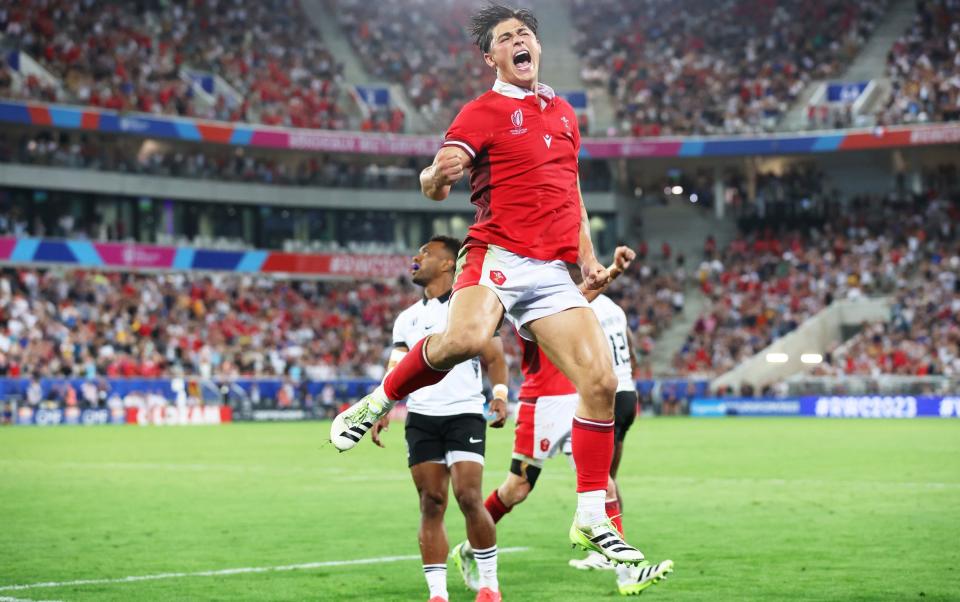 Louis Rees-Zammit, who has switched sports from rugby union to American football, celebrates a Wales win at the Rugby World Cup 2023