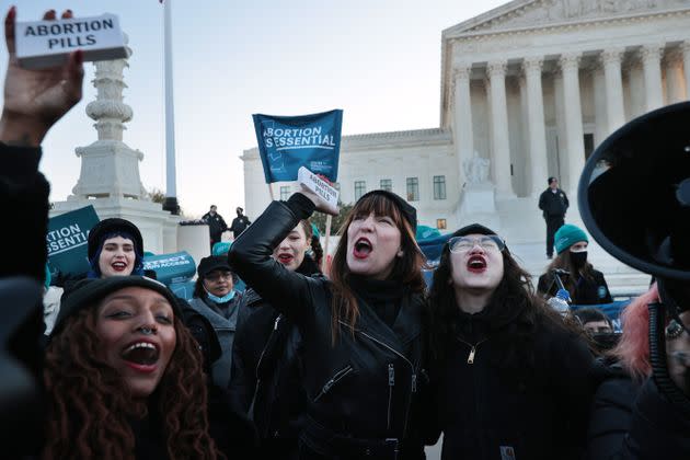 Demonstrators Alana Edmondson, Lila Bonow, Amelia Bonow and Aiyana Knauer celebrate after taking abortion pills while demonstrating in front of the U.S. Supreme Court as the justices hear arguments Wednesday.  (Photo: Chip Somodevilla via Getty Images)