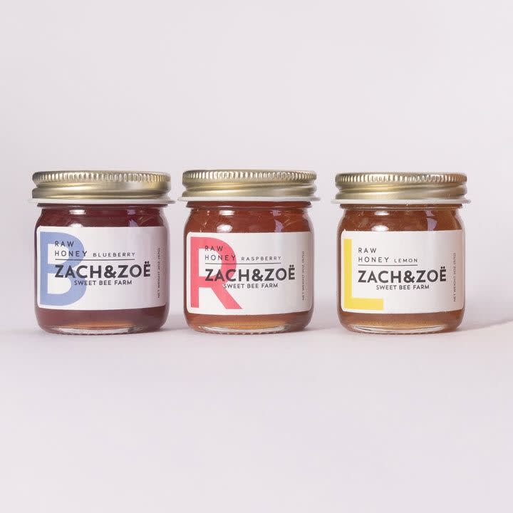 <p><a href="https://zachandzoe.co/collections/gifts/products/giftbox-with-3-flavors-of-wildflower-honey-2oz" rel="nofollow noopener" target="_blank" data-ylk="slk:Shop Now;elm:context_link;itc:0;sec:content-canvas" class="link ">Shop Now</a></p><p>Wildflower Honey Sampler </p><p>zachandzoe.co</p><p>$28.00</p>