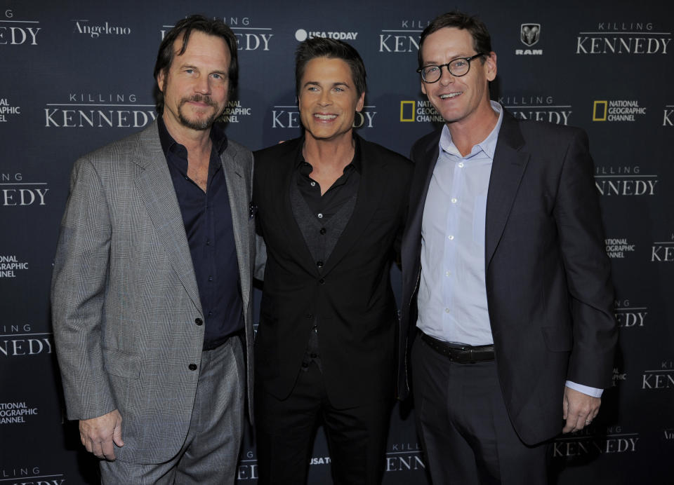 Rob Lowe, center, star of the film "Killing Kennedy," poses with actor Bill Paxton, left, and Howard T. Owens, president of National Geographic Channel, at the premiere of the film "Killing Kennedy" at the Saban Theatre on Monday, Nov. 4, 2013 in Beverly Hills, Calif. (Photo by Chris Pizzello/Invision/AP)