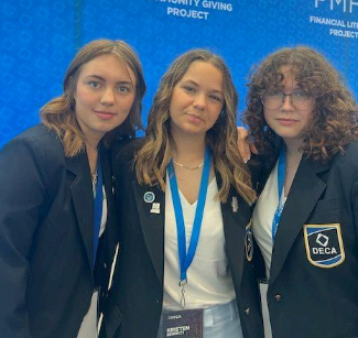 Ann Lord, Kristin Bennett, and Emma Rigg place in the top 20 in the Community Giving category of the DECA International Career Development Conference in Anaheim, California. Photo courtesy of Dr. Shannon Castillo.