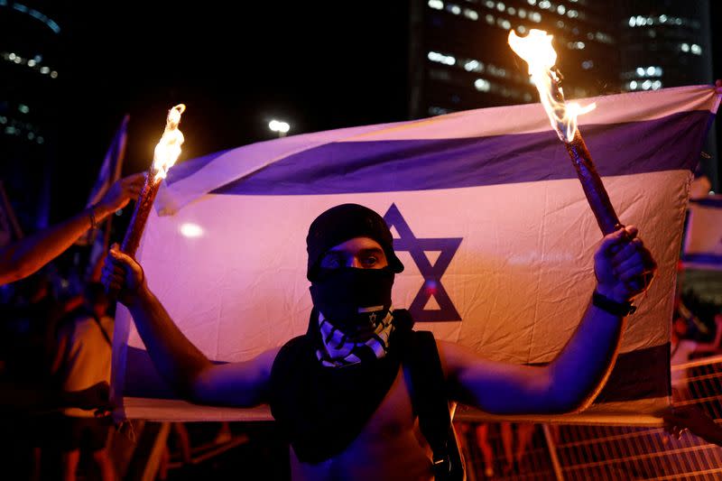 FILE PHOTO: Demonstration following a parliament vote on a contested bill that limits Supreme Court powers to void some government decisions, in Tel Aviv