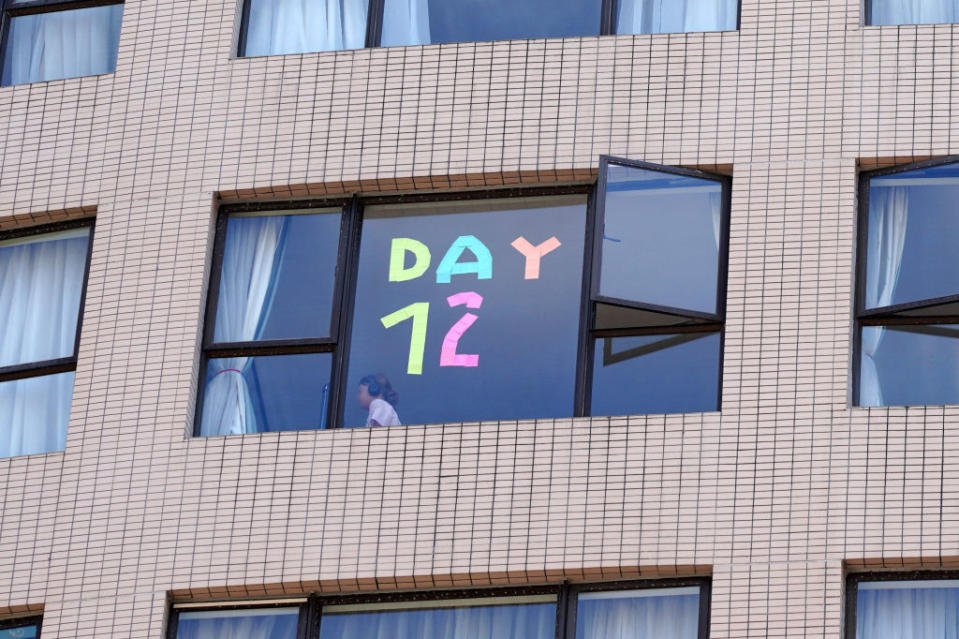 'Day 12' stickers are displayed on the window of Dorsett Wanchai Hong Kong Hotel to record quarantine days on August 17, 2021 in Hong Kong, China.<span class="copyright">Zhang Wei/China News Service via Getty Images</span>