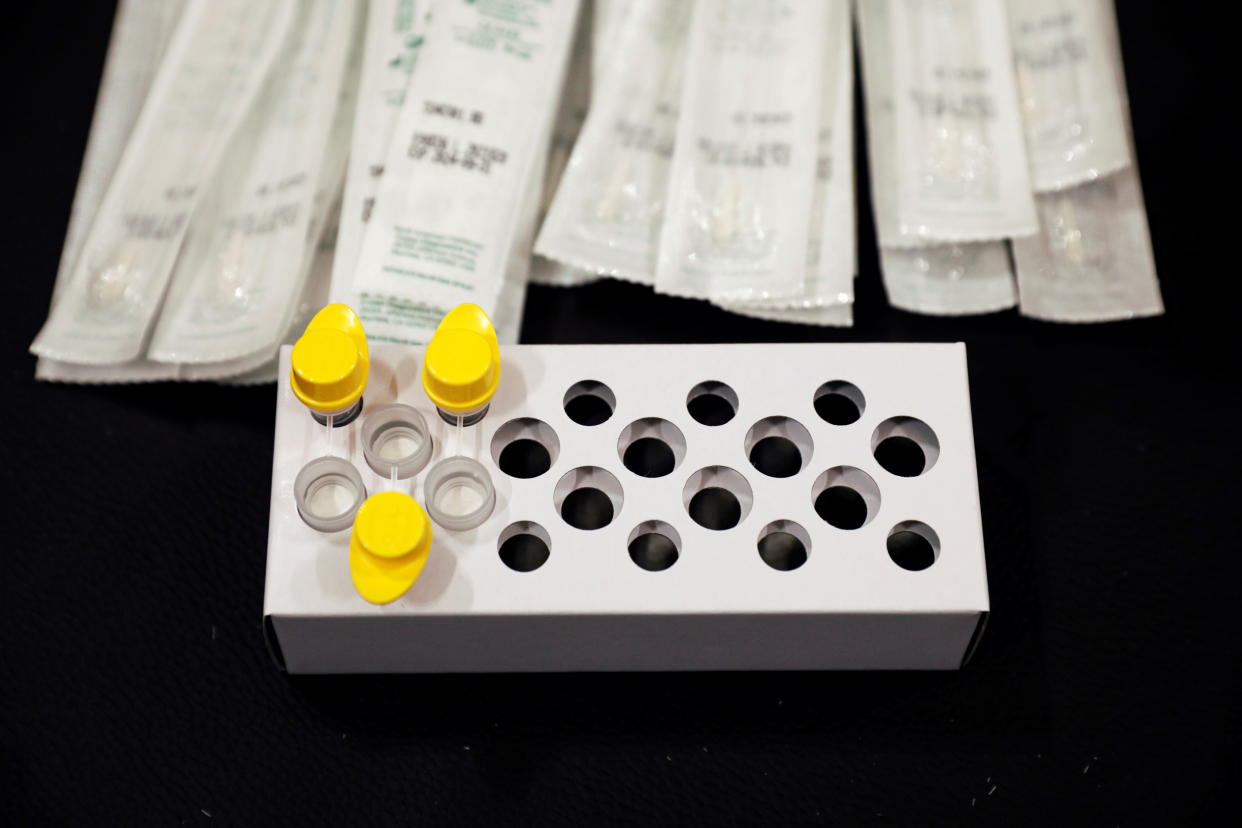 Nasal swab sticks and liquid reagents are pictured at a COVID-19 screening station in Singapore.