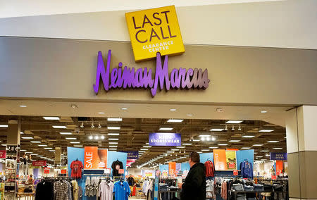 FILE PHOTO - A customer walks by the Neiman Marcus Last Call store in Golden, Colorado, U.S. on January 23, 2014. REUTERS/Rick Wilking/File Photo