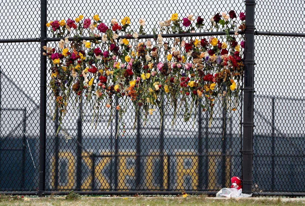 An outpouring of support and memorials popped up around the small town of Oxford, Michigan like these flowers that were woven into a fence on the grounds of Oxford High School after four students were shot and killed and multiple others wounded when a classmate opened fire on Nov. 30, 2021.