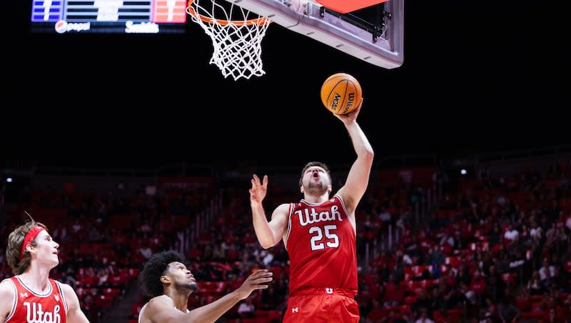 Utah guard Rollie Worster (25) lays the ball up during a game against Washington at the Huntsman Center in Salt Lake City on Saturday, Jan. 21, 2023.