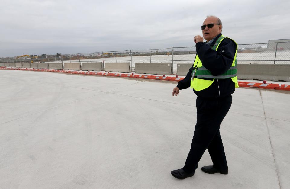 Airport Director Michael Daigle shows some of the completed areas during a multi-year tarmac and ramp replacement project Wednesday, Nov. 8, 2023, at the South Bend International Airport.