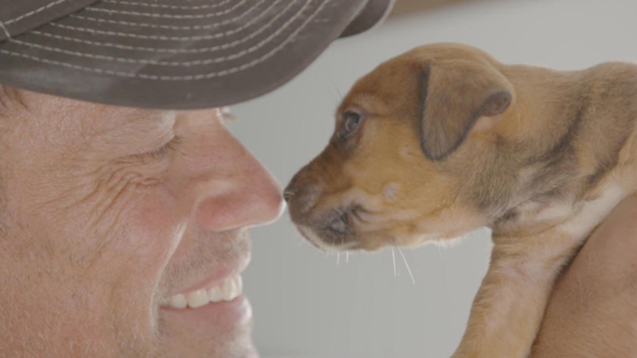 Thron with a rescue puppy. (Photo: CuriosityStream)