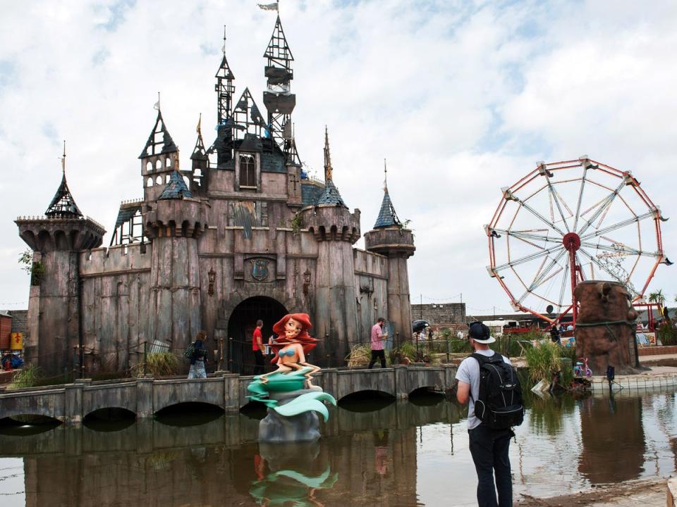 Thousands attended the Dismaland theme park, created by Banksy, on Weston-super-Mare’s seafront in 2015 (Rex Features)