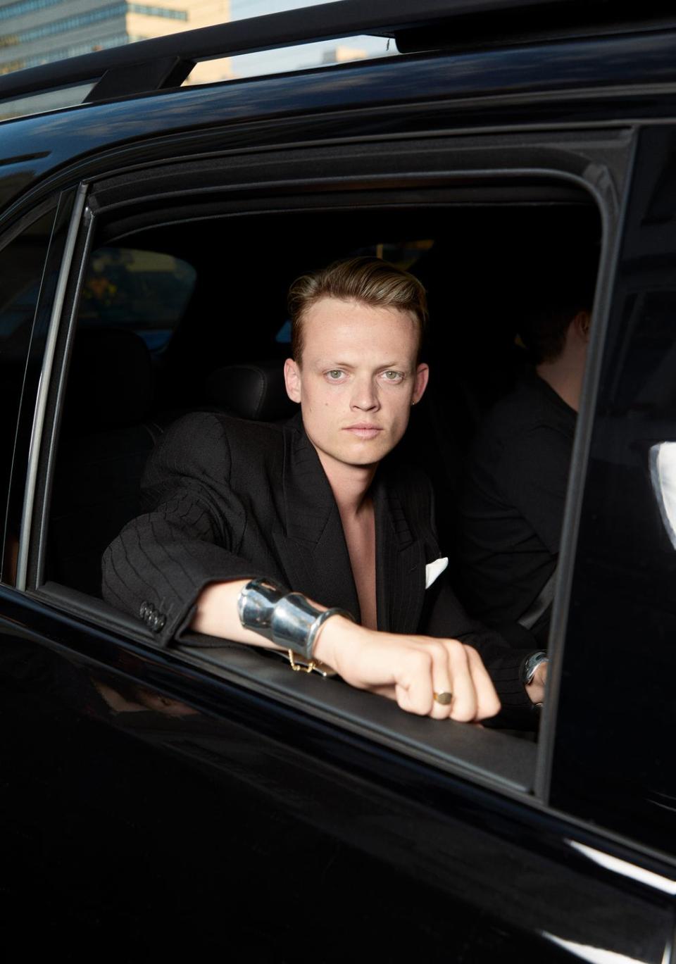 anson boon in the car to saint laurent men's show