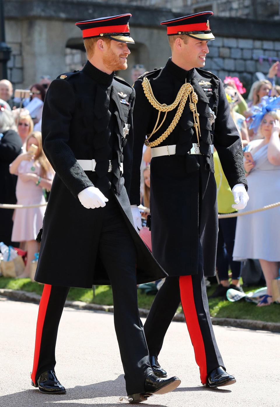 Prince Harry (left) walks with his best man, Prince William, Duke of Cambridge as they arrive at St George's Chapel at Windsor Castle before the wedding of Prince Harry to Meghan Markle on May 19, 2018 in Windsor, England