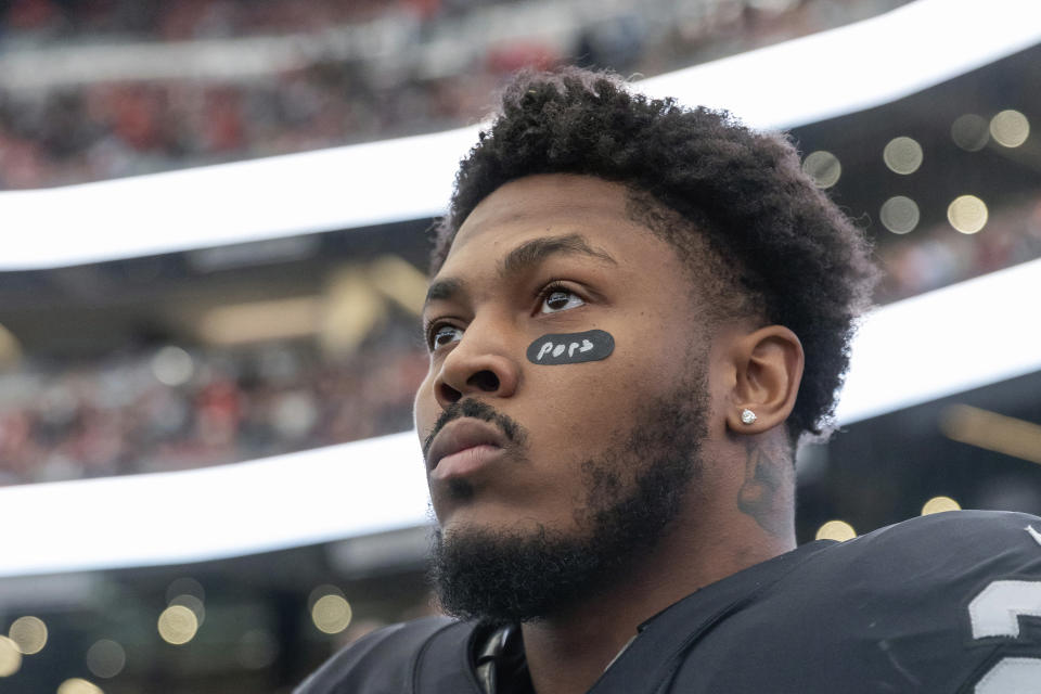 FILE - Las Vegas Raiders running back Josh Jacobs (28) stands on the sideline before playing against the Kansas City Chiefs in an NFL football game, Saturday, Jan. 7, 2023, in Las Vegas, NV. The Raiders and running back Josh Jacobs are at a contract impasse. Las Vegas placed the franchise tag on Jacobs, but he has not signed and hopes for a long-term contract. (AP Photo/Jeff Lewis, File)