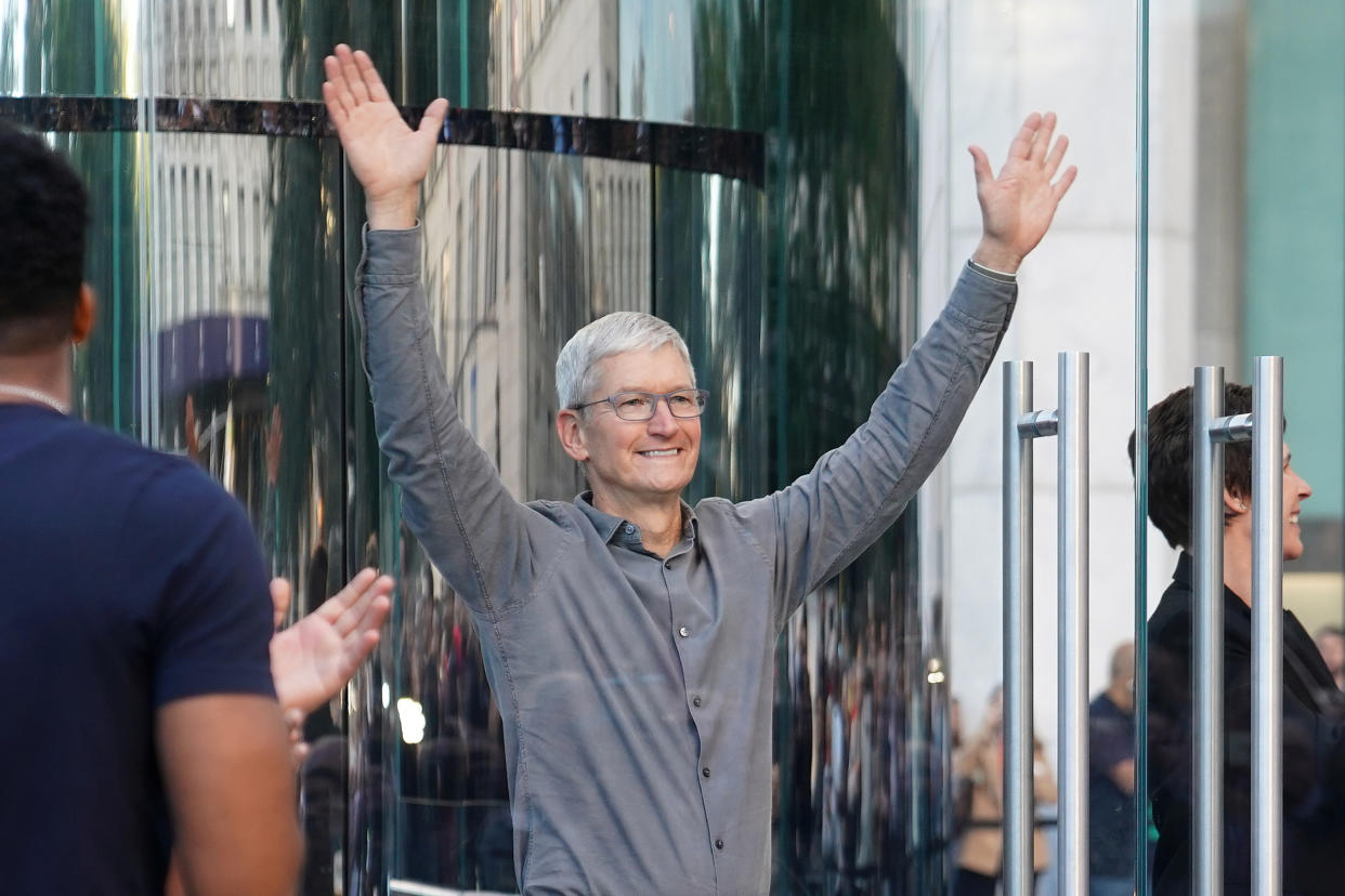 Apple CEO Tim Cook greets fans outside the Apple Store on Fifth Ave in the Manhattan borough of New York, New York, U.S., September 20, 2019. REUTERS/Carlo Allegri