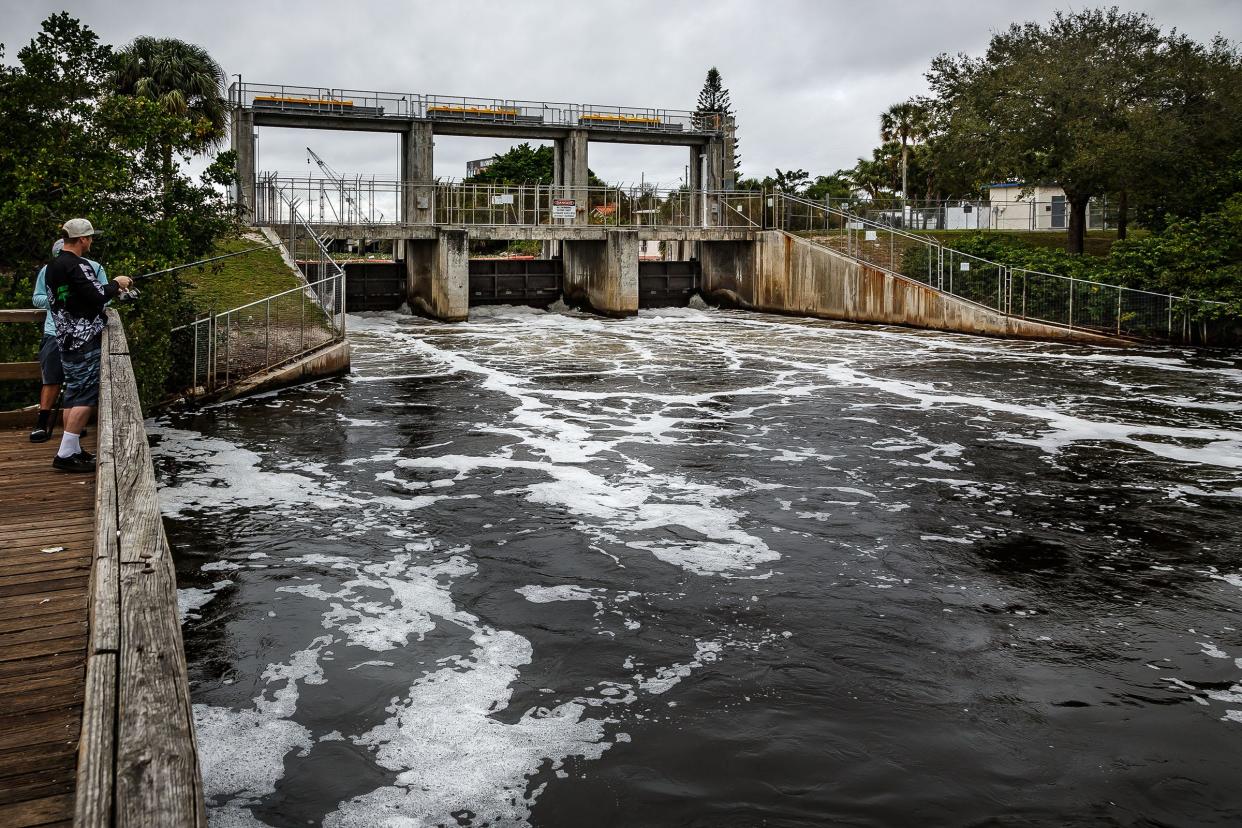 About eight thousand gallons per second of water flows through the South Florida Water Management District's Control Structure S-155 on Canal C-51 in Spillway Park east of Dixie Highway near the Lake Worth and West Palm Beach, Fla. city limits on February 1, 2016. SFWMD is moving water to control canal levels after unprecedented rainfall in the last few months in south Florida. (Thomas Cordy / The Palm Beach Post)