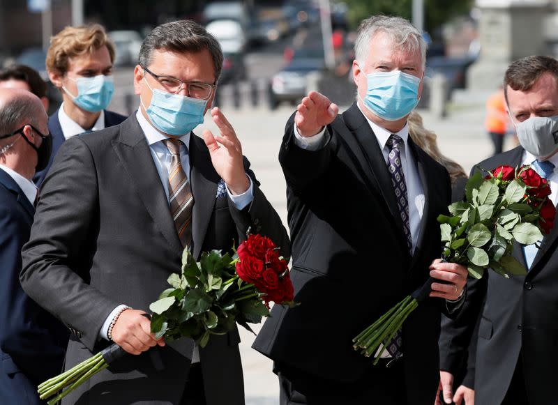 FILE PHOTO: Ukrainian Foreign Minister Kuleba and U.S. Deputy Secretary of State Biegun attend a flower-laying ceremony in Kyiv